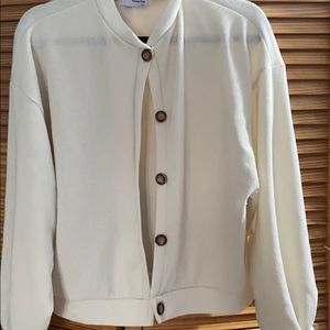 Cream sweater with tortoise buttons